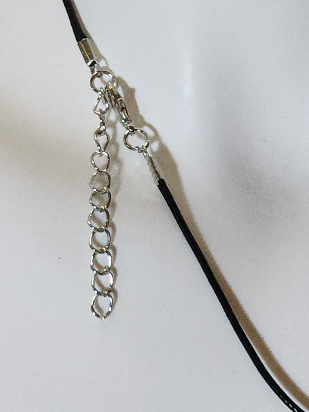 Silver Toned Teardrop Pendant Necklace On A Black Nylon Cord - Picture 3 of 8